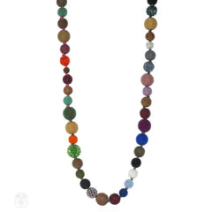 A long multi-colored hand-beaded ball necklace comprising 52...