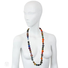 A long multi-colored hand-beaded ball necklace comprising 52...