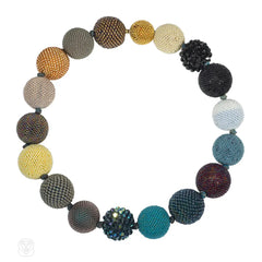 A multi-colored beaded ball necklace comprising 18 spheres w...