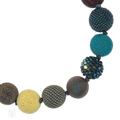 A multi-colored beaded ball necklace comprising 18 spheres w...