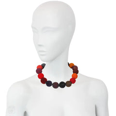 A multi-colored beaded ball necklace comprising 18 spheres w...