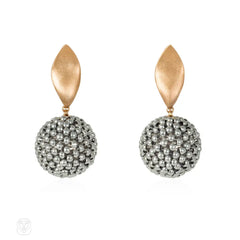 A pair of handmade beaded ball earrings comprising rare anti...