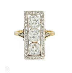 Antique three-stone diamond, platinum, and gold plaque ring