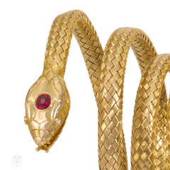 Antique woven gold coiled snake bracelet with gemset head