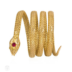 Antique woven gold coiled snake bracelet with gemset head