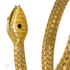 Antique woven gold coiled snake bracelet with gemset head