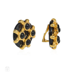 Cipullo for Cartier onyx and gold disc-shaped earrings.