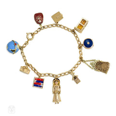 Mid-Century gold bracelet with gold and enamel charms