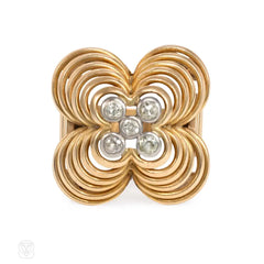 Retro gold, platinum, and diamond flower-form ring.