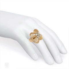 Retro gold, platinum, and diamond flower-form ring.